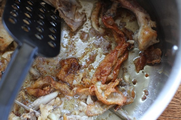 browned chicken parts in pot.